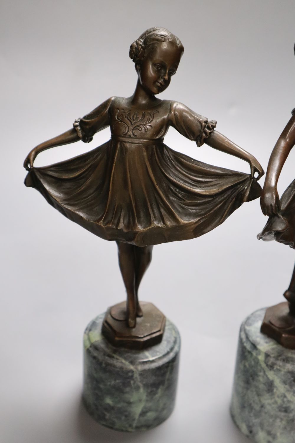 After Preiss - A pair of modern French bronzes of dancing girls, on marble plinths, 26cm high